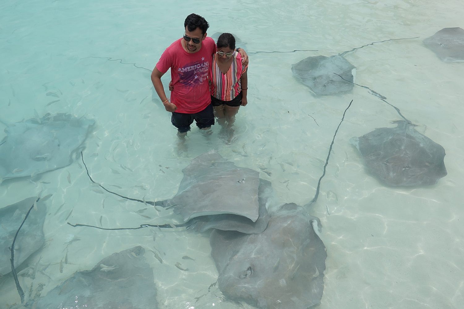 Couple with beach fishes